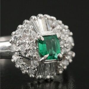 Elegant Platinum Emerald and Diamond ring